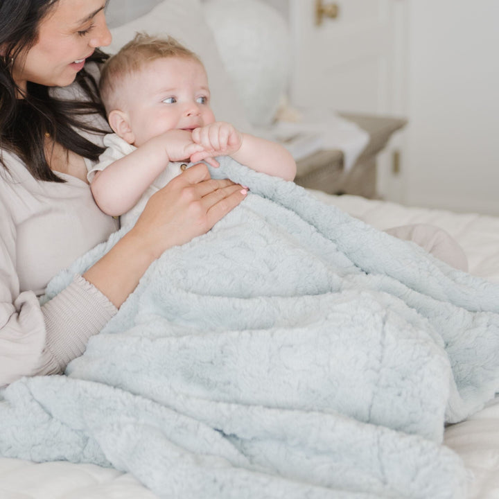 Designed with love, the Saranoni Dream Mini Blanket in Sweet Mint is a must-have baby blanket for gentle, cozy comfort.