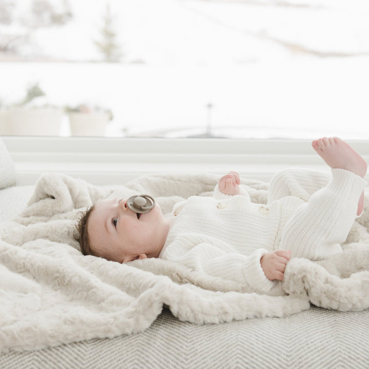 In Oat, the Saranoni Dream Receiving Blanket feels like a warm hug, one of the best receiving blankets for infants.