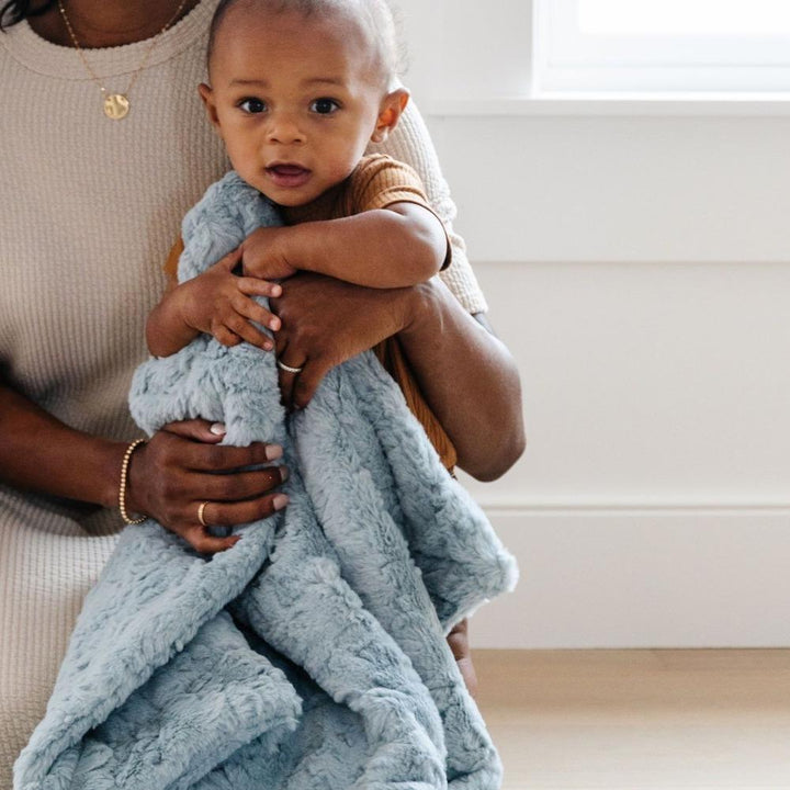 In Heather Blue, the Saranoni Dream Receiving Blanket is soft, soothing, and perfect for baby girl blankets.