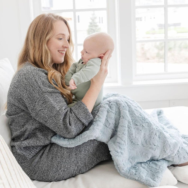 Saranoni Dream Receiving Blanket in Heather Blue combines plushness and breathability, a top pick among best baby blankets.