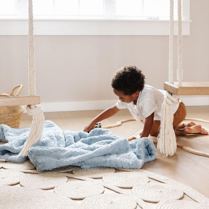 The Saranoni Dream Toddler Blanket in Heather Blue brings plush serenity, an ideal pick for soft toddler blankets.