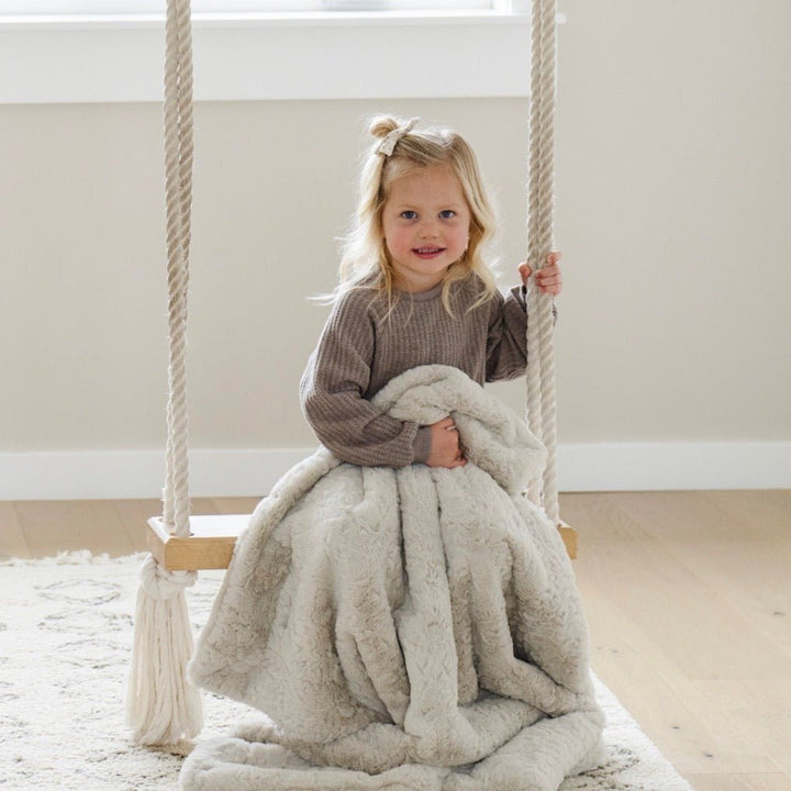 In Oat, the Saranoni Dream Toddler Blanket adds cozy charm, making it one of the best blankets for toddlers.