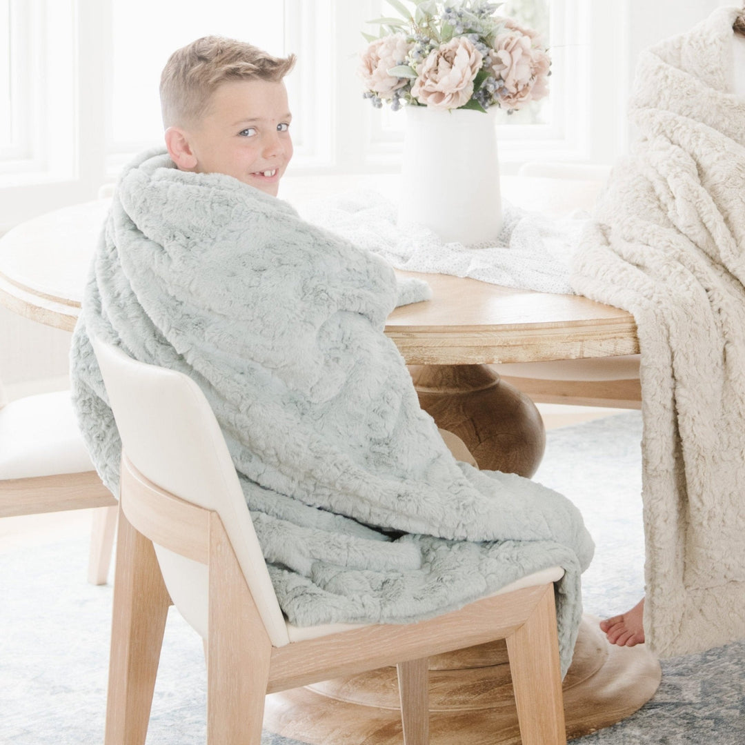 Soft and stylish, the Saranoni Dream Toddler Blanket in Sweet Mint brings calm comfort to any nursery, a favorite baby blanket.