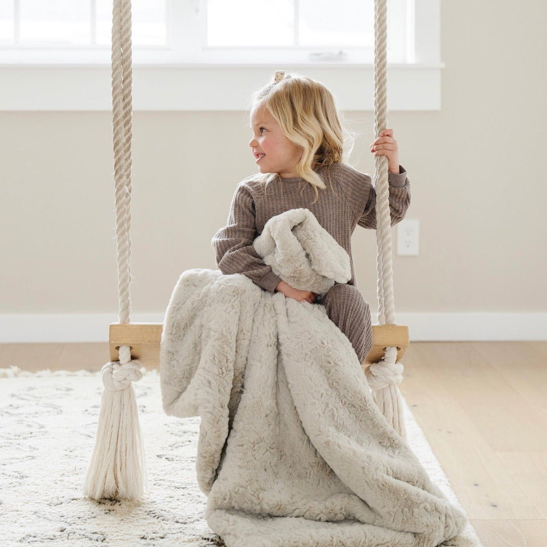 Perfectly plush, the Saranoni Dream Toddler Blanket in Oat surrounds your child with softness, ideal for baby girl blankets.