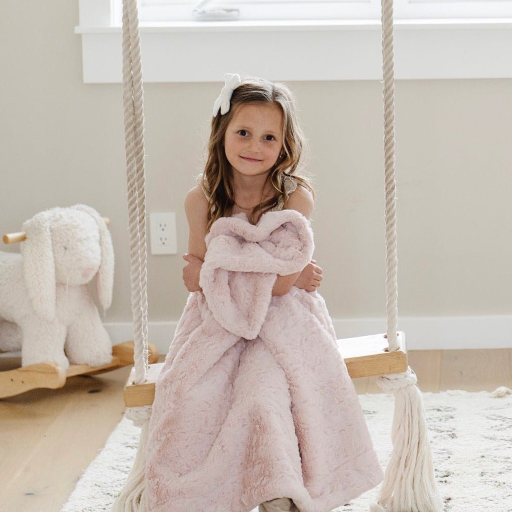 Crafted for comfort, the Saranoni Dream Toddler Blanket in Blush brings cozy elegance to soft baby blankets.
