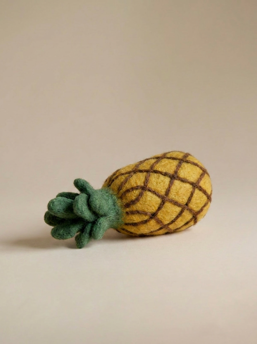 Close-up detail of Kaddu's Felt Pineapple showing handcrafted wool texture