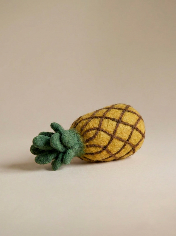 Close-up detail of Kaddu's Felt Pineapple showing handcrafted wool texture