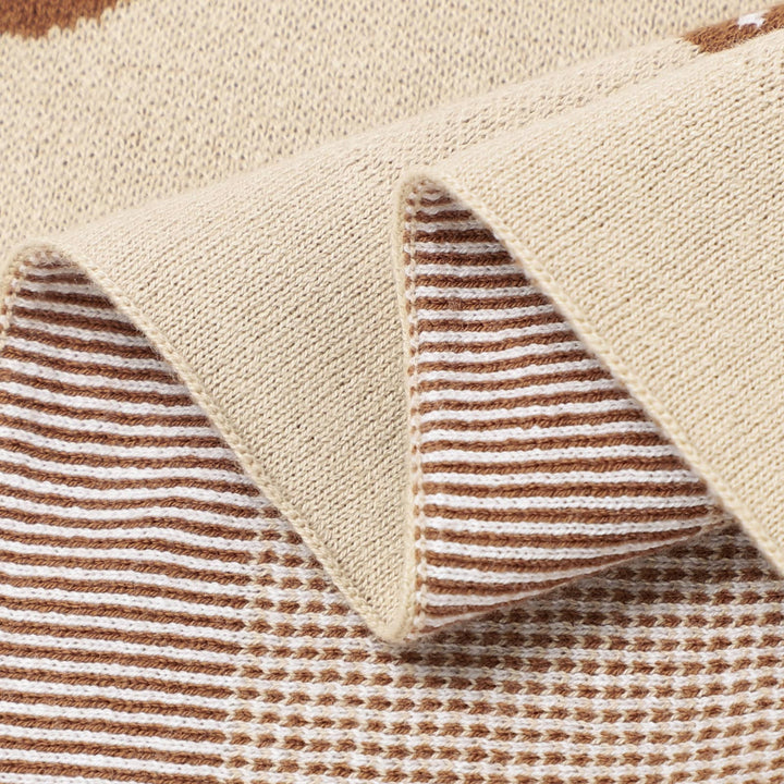 Close-up of a underside of the Bleu La La Cotton Swaddle Receiving Baby Blanket Camel with mushroom design