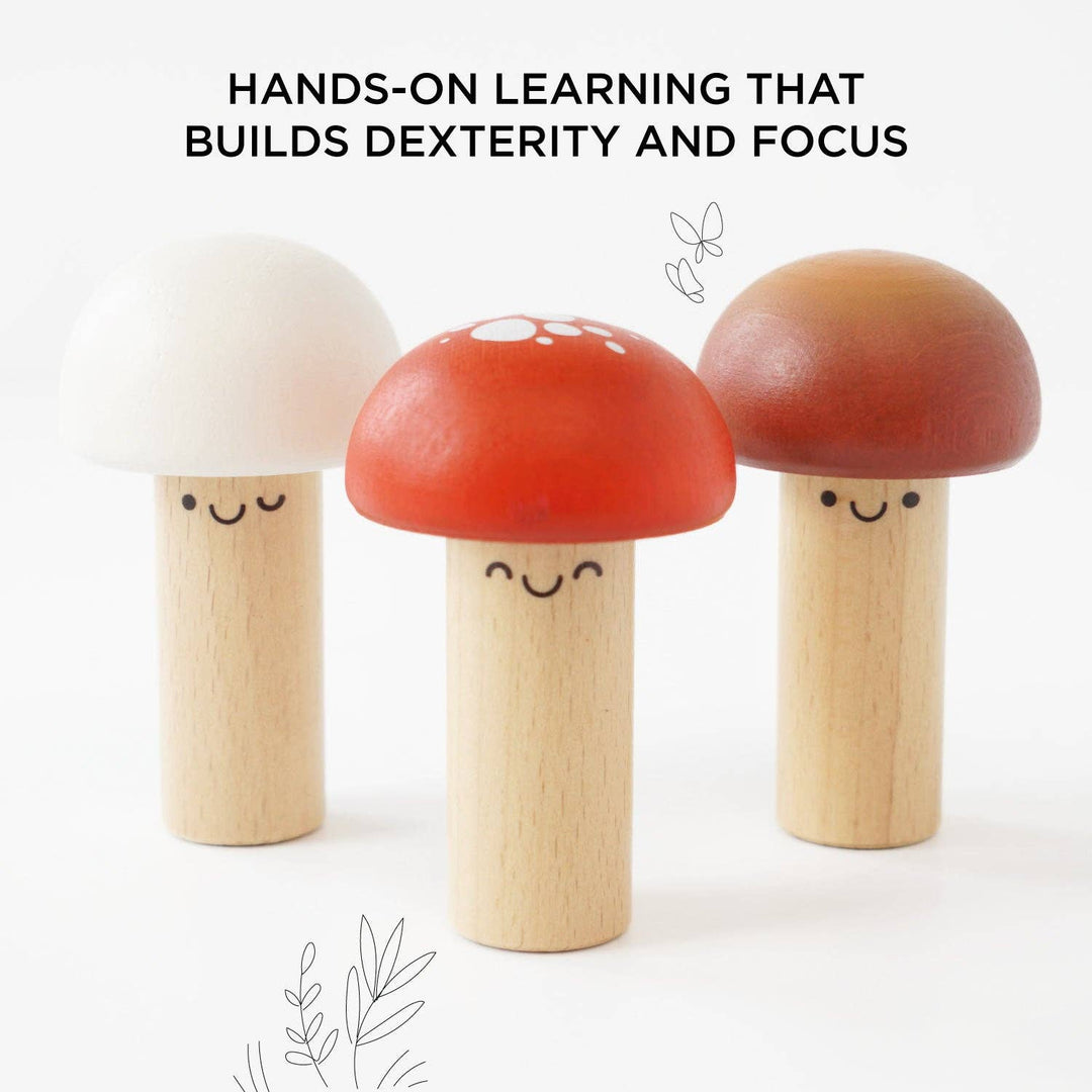 Close up of three rounded mushroom faces from Le Toy Van's Hammer Game, designed to sharpen focus