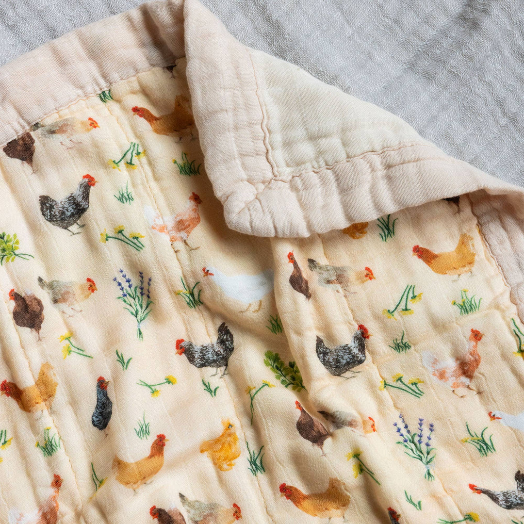 Folded Chicken Meadows muslin baby blanket by 1canoe2 showing scalloped edge, a soft lovey for baby girl or boy