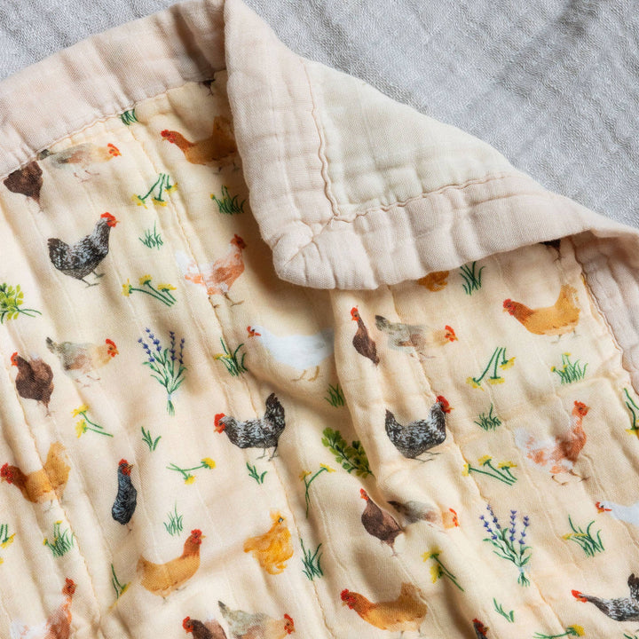 Folded Chicken Meadows muslin baby blanket by 1canoe2 showing scalloped edge, a soft lovey for baby girl or boy
