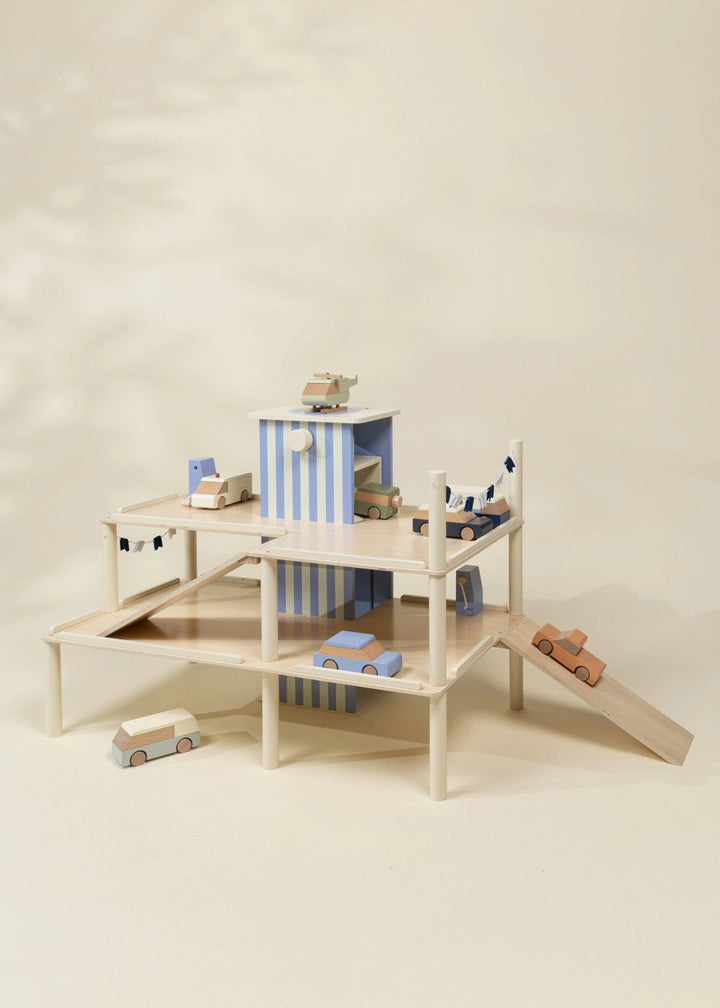 Coco Village Oversized Wooden Parking Garage Playset showing multiple ramps and toy cars