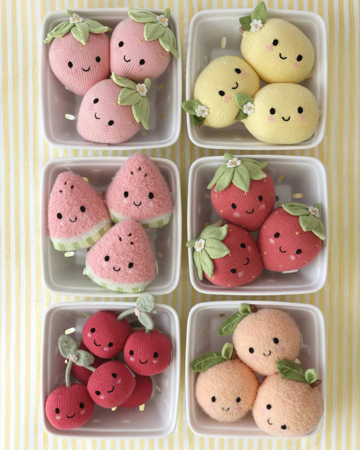 Soft cotton knit watermelon plush toy Cuddle + Kind Baby Watermelon, a sweet nursery keepsake
