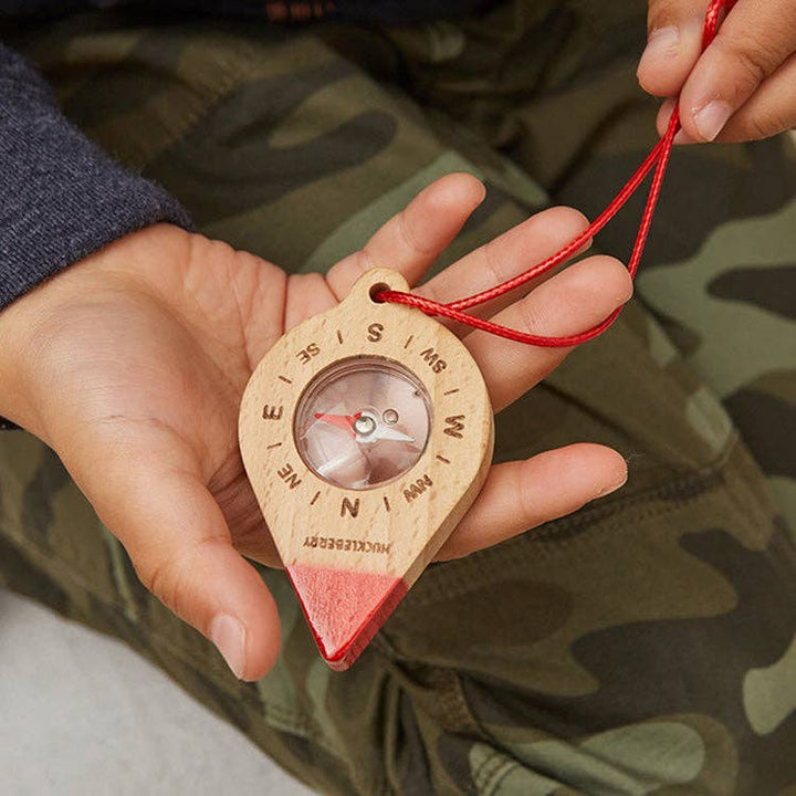 Child using Huckleberry Compass outdoor navigation toy