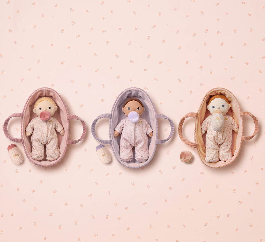 Three Binky Dinky baby dolls in pink, lavender and peach bassinets from Dinkum Dolls