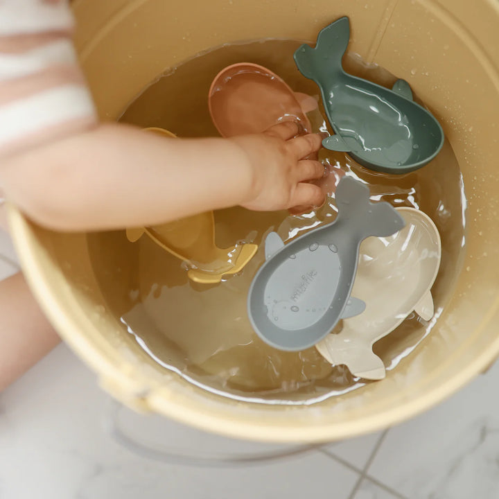 Mushie Whale Bath Stackers Original styled flat lay - silicone bath stackers with Scandinavian-inspired styling