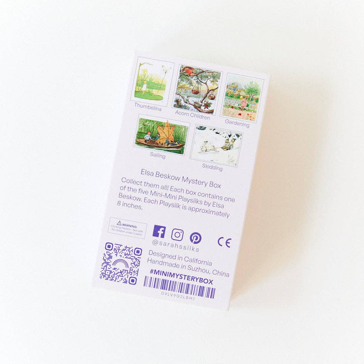 The back of the Sarah's Silks packaging lists care details for the Elsa Beskow Mini Mystery Playsilk
