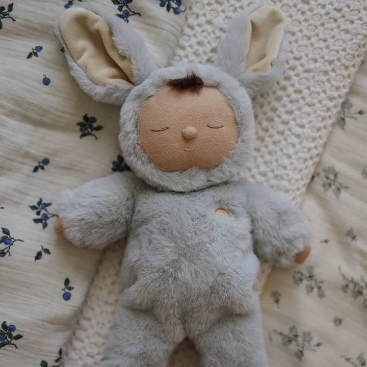 olli ella lullaby cozy bunny dinkums smoke sleeping on blueberry patterned sheets 