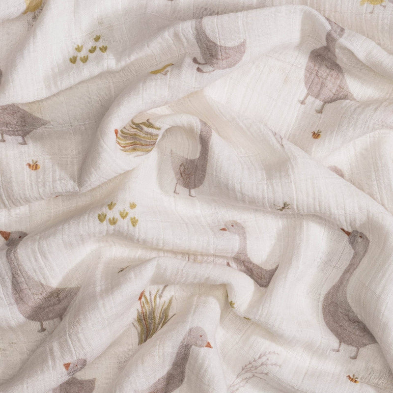 close up of crane baby goose swaddle pattern perfect for whimsical baby shower theme 