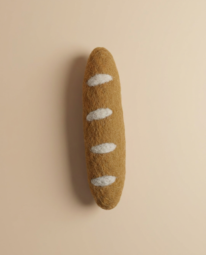 Close-up detail of Kaddu's Felt French Baguette showing wool texture