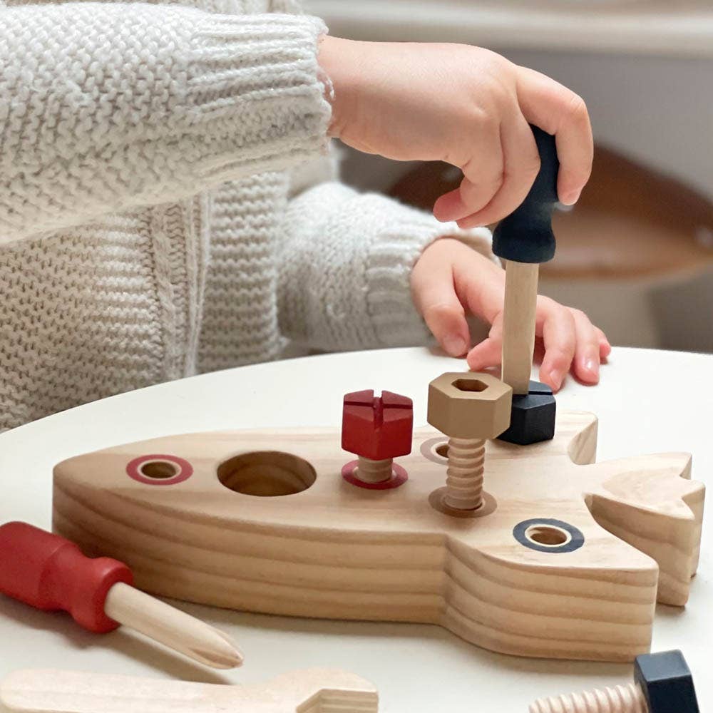 child assembling part of egmont toys rocket assembly toy educational wooden toys for children