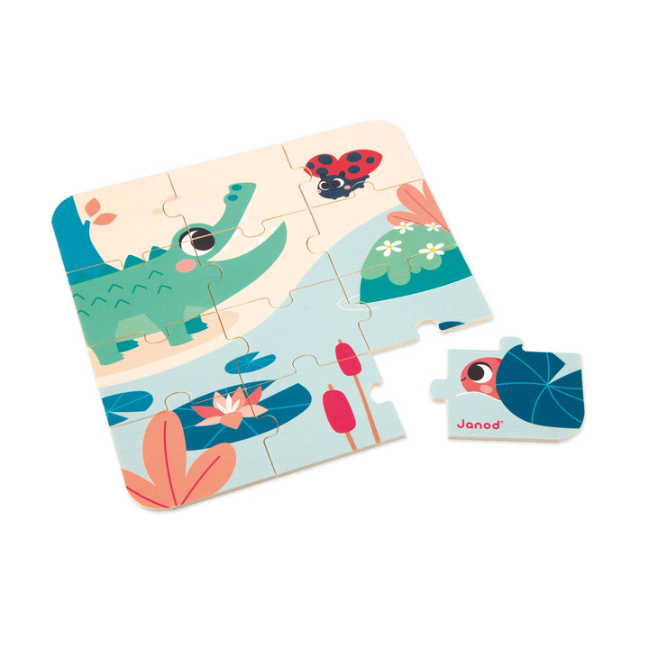 Close-up of wooden puzzle pieces from Janod 24 month toy box