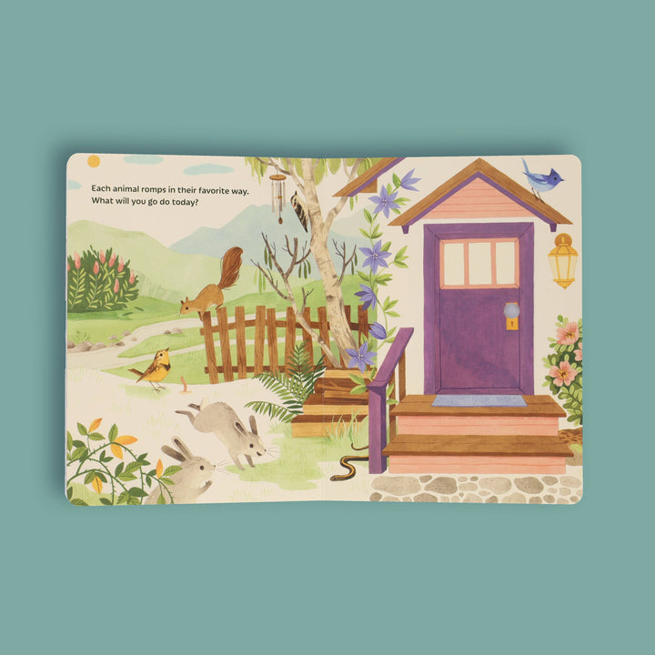 Sunrise Dance illustrated spread with a cozy woodland cottage scene