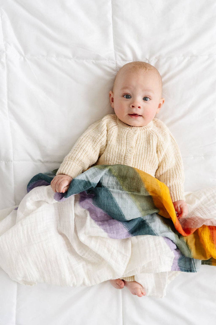 Soft and breathable Clementine Kids Rainbow Swaddle, an ideal muslin swaddle for infants.