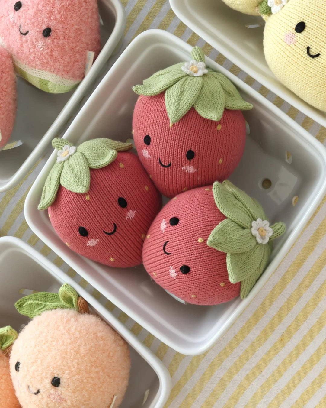 Baby Strawberry by Cuddle + Kind, a 7-inch knit strawberry plush toy that gives 5 meals