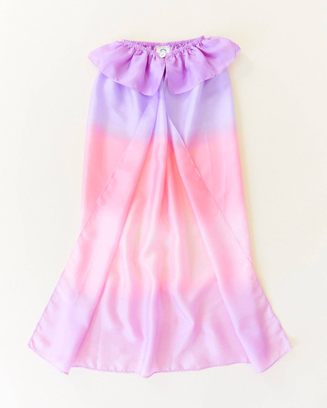 Sarah's Silks Blossom Cape shown flat, highlighting its soft ombre from lavender to pink