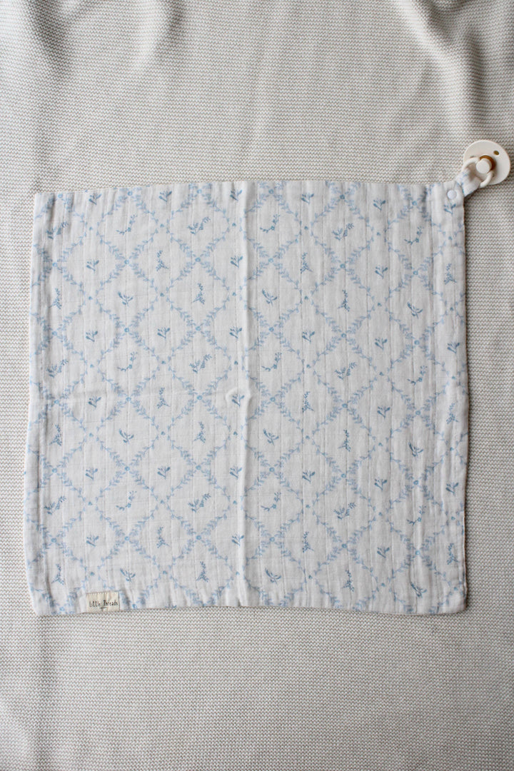 Little Threads baby lovey laid flat from above showing quilted blue lattice texture