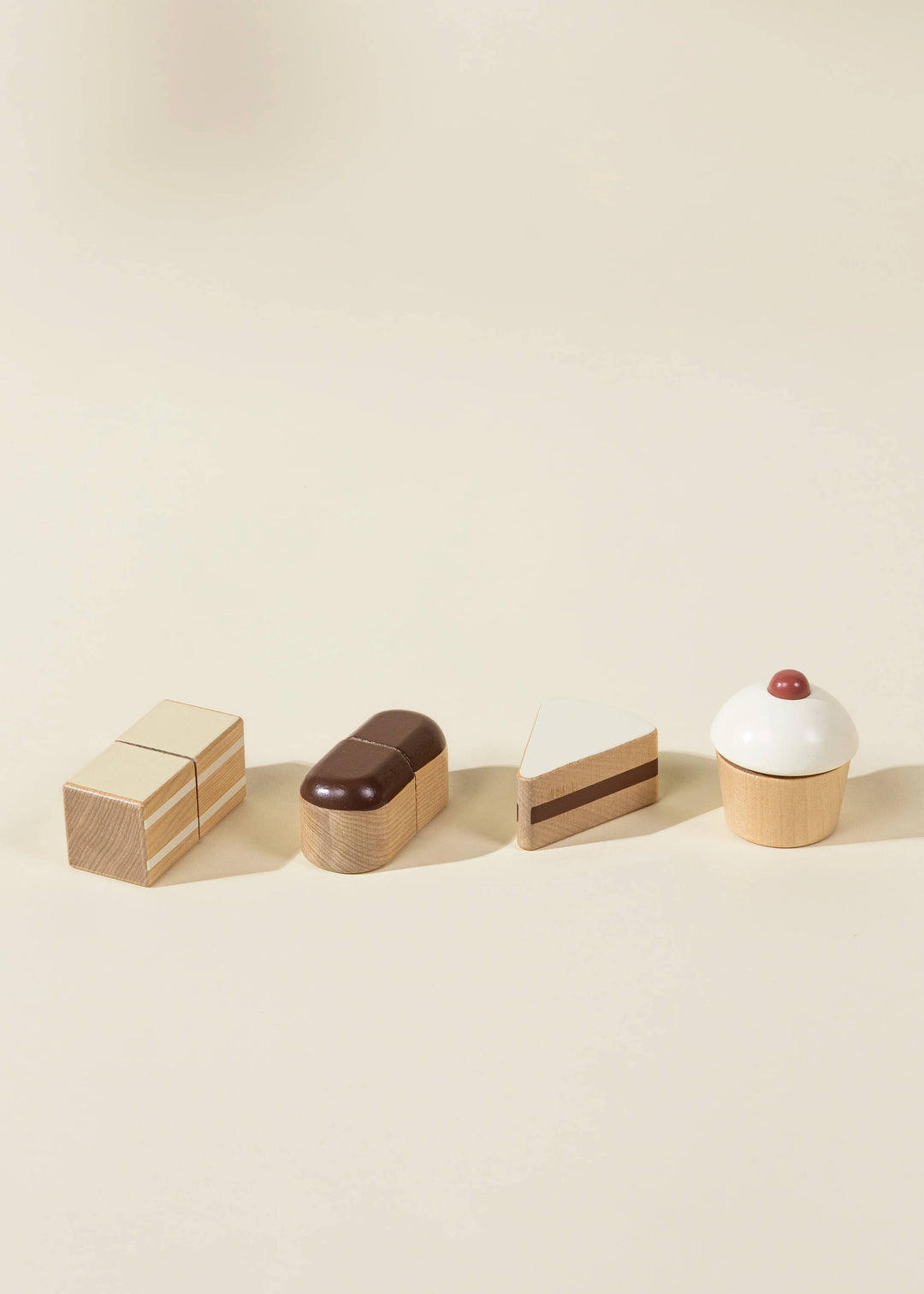 Crafted from natural wood, the Coco Village Wooden Desserts Tower is a safe and beautiful addition to any pretend play kitchen.