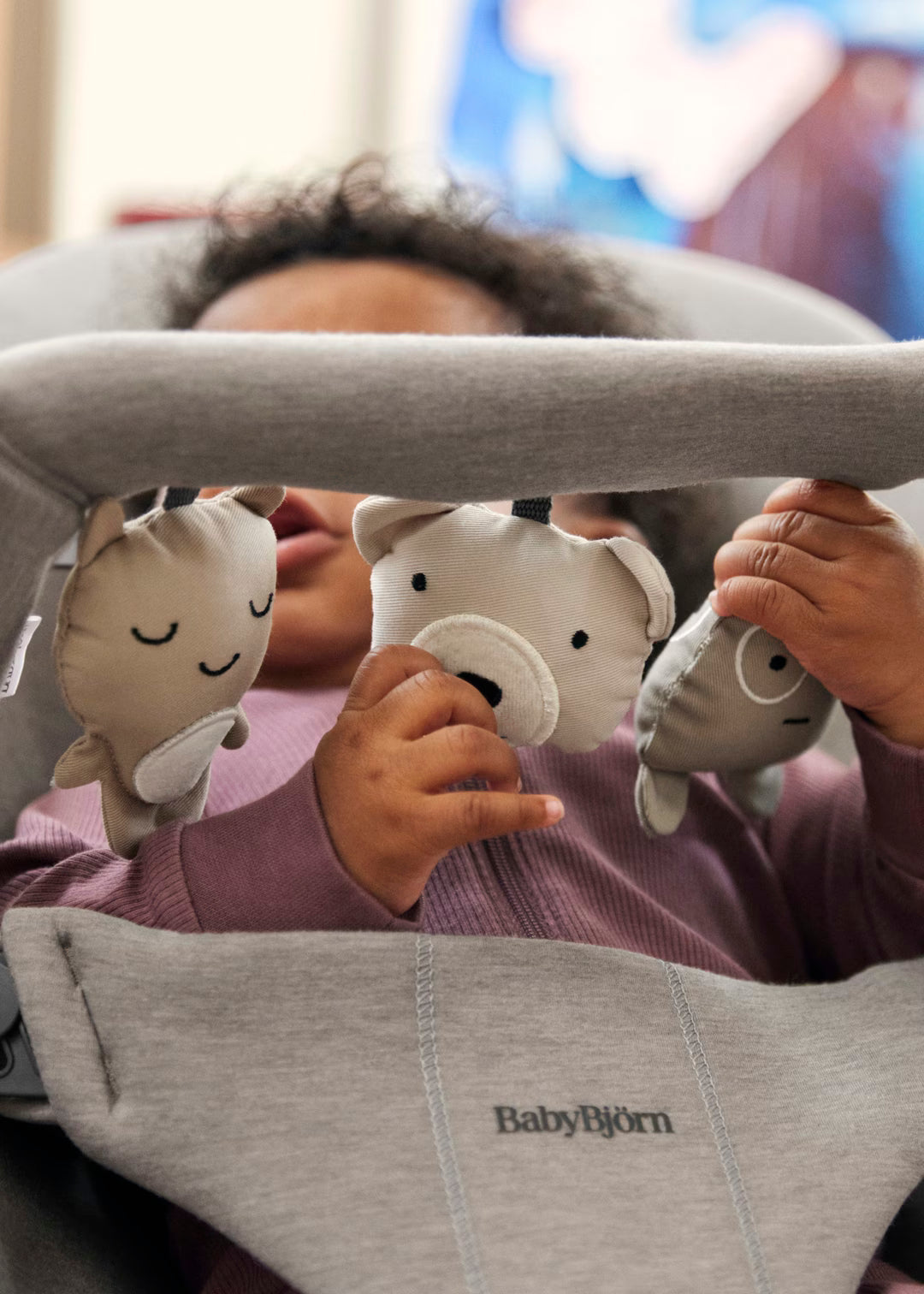 BabyBjorn Bouncer Toy fold and carry configuration showing compact portability for travel