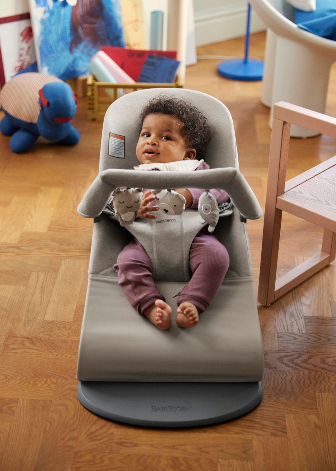 BabyBjorn Bouncer Toy color variant view showing available seat color and fabric options