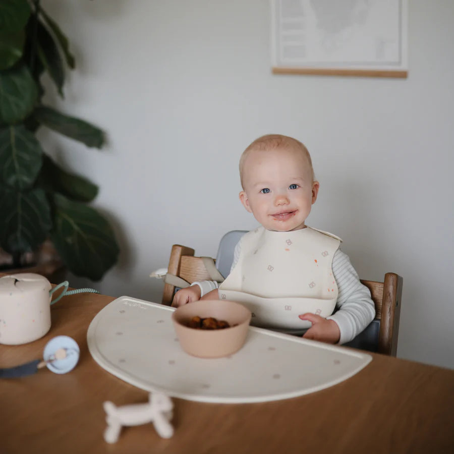 Mushie placemat in Pretzel