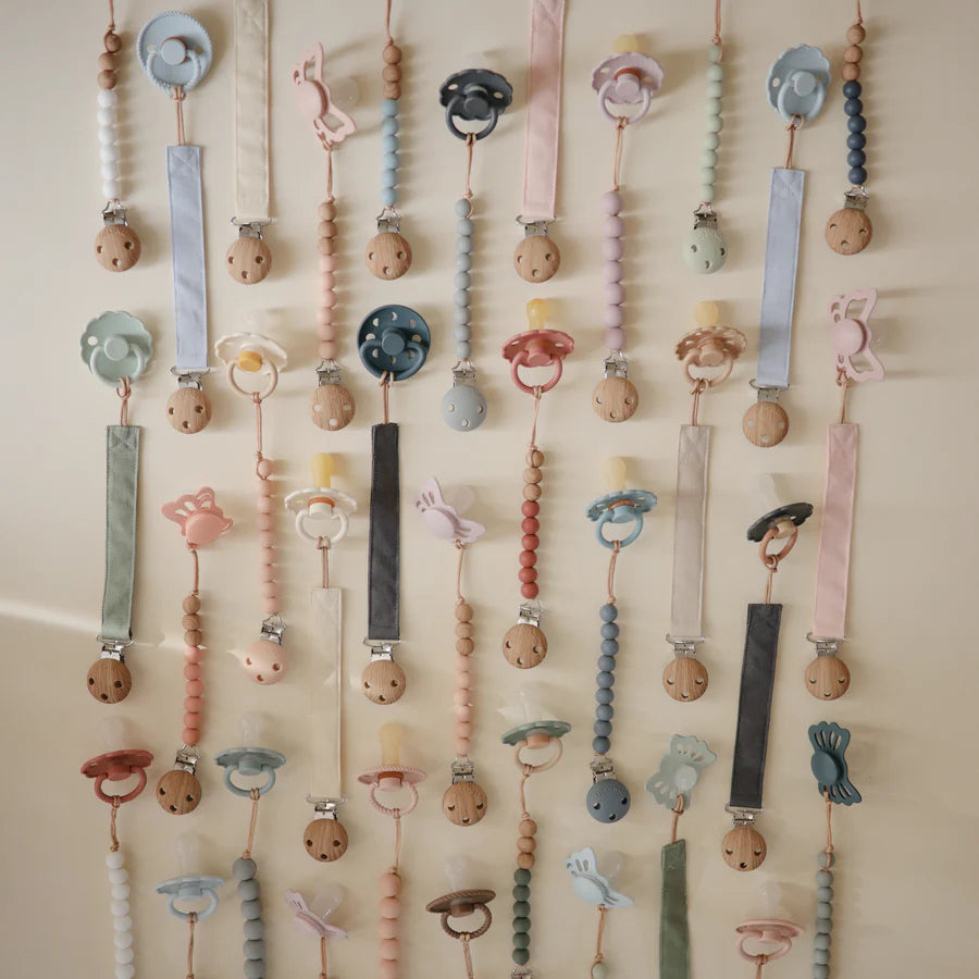 Elegant Collection of Mushie Linen Pacifier Clips designed for secure and cute pacifier clips.