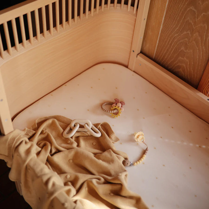 Stylish and practical, the Mushie Eva Pacifier Clip in Mustard Yellow is perfect for pacifier clips.