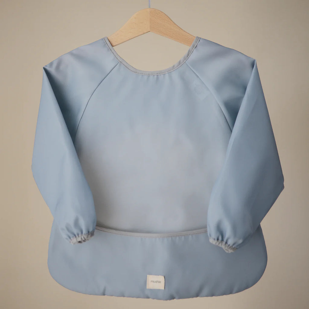 Mushie blue bib with sleeves