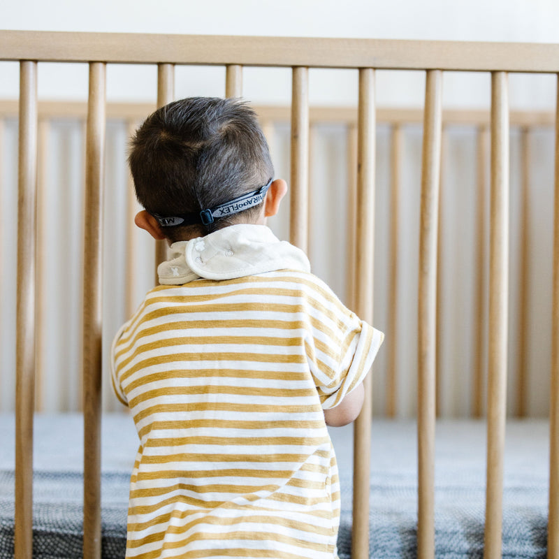 Little Unicorn Cotton Muslin + Fleece Bandana Bib 4 Pack - Mauve Stripe displayed flat, lightweight and easy-care bibs for babies.