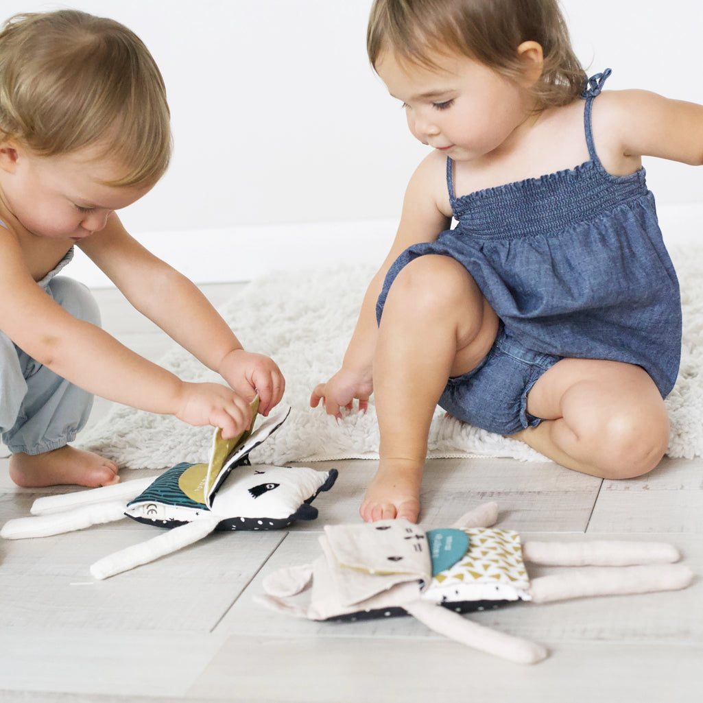 babies playing with wee gallery flippy friend