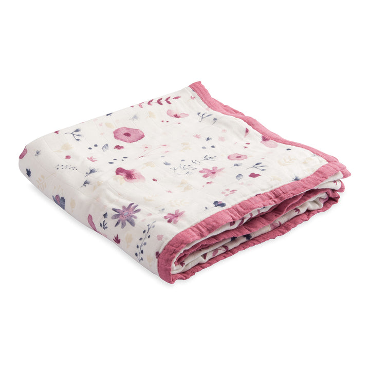 Folded and ready to snuggle, the Little Unicorn Deluxe Muslin Quilt - Fairy Garden brings magic to baby quilts.