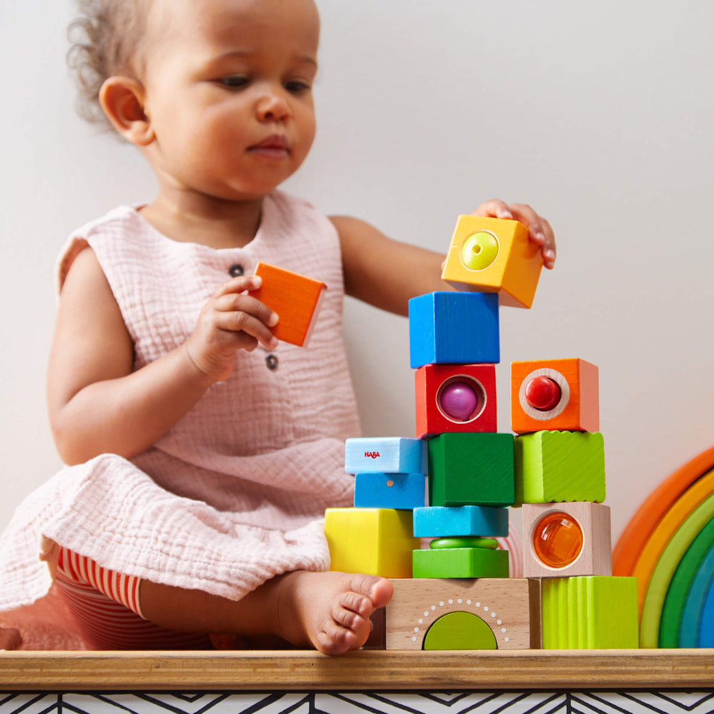 baby stacking wooden montessori blocks by haba