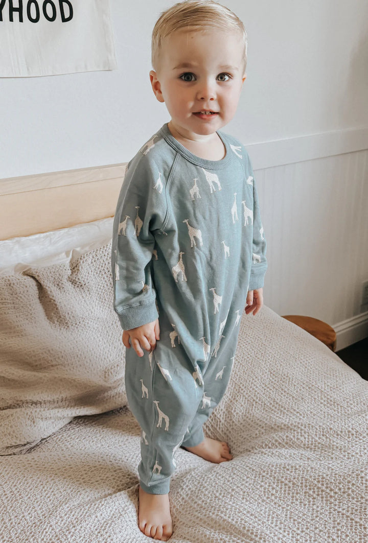 The Gunamuna Fleece Jumpsuit in Giraffe Moss offers comfortable baby clothes for everyday wear.
