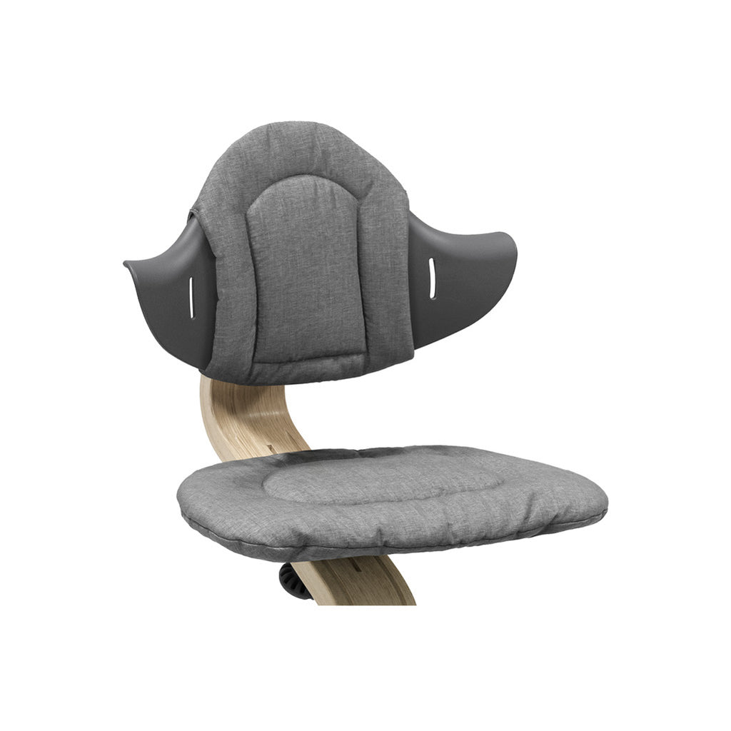 grey cushion on stokke Nomi wooden high chairs