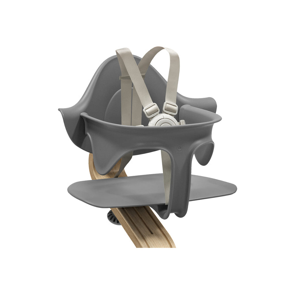 A close up of the grey stokke nomi high chair.