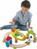 boy playing with haba spiral track starter set with roller ball