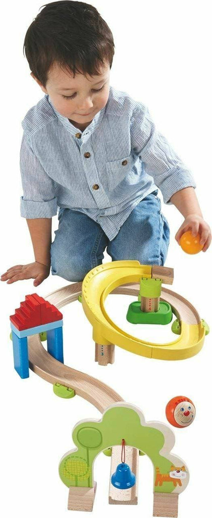 child playing with kullerbu haba spiral starter track set