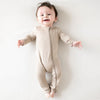 Happy baby wearing adorable Zipper Romper in the shade Khaki.