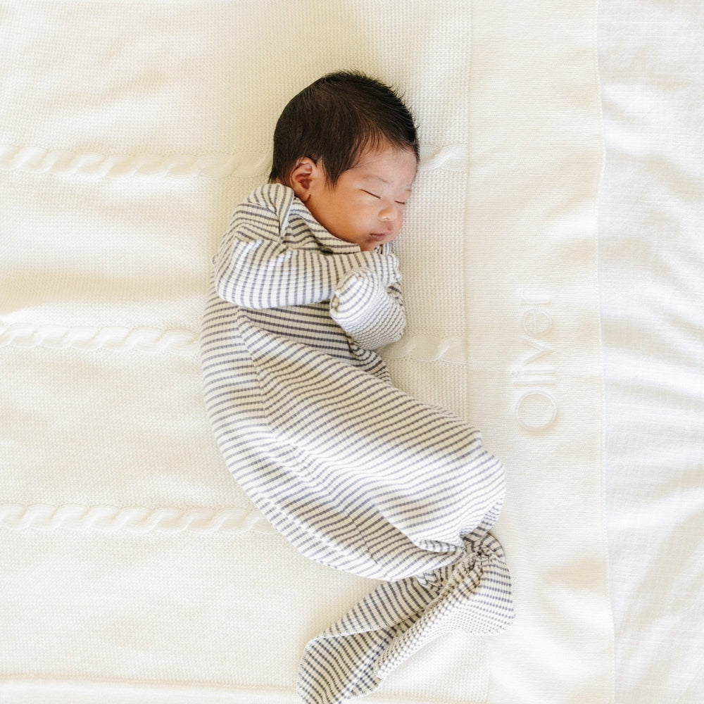 Warm texture of the Saranoni Heirloom Cotton Knit Receiving Blankets in Cream makes this baby girl blankets favorite.