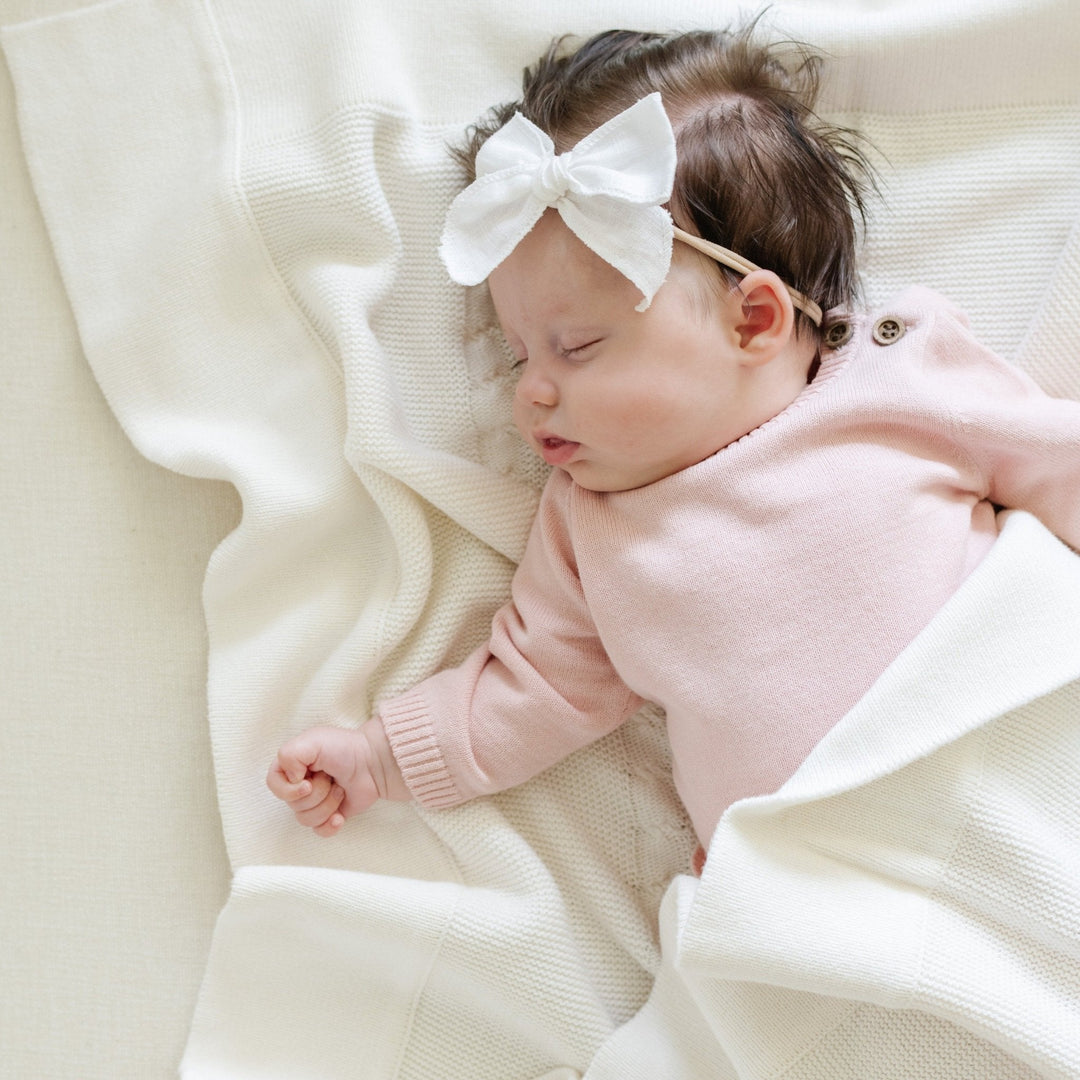 Saranoni Heirloom Cotton Knit Receiving Blankets in Cream shown folded beautifully, perfect soft baby blankets for gifting.